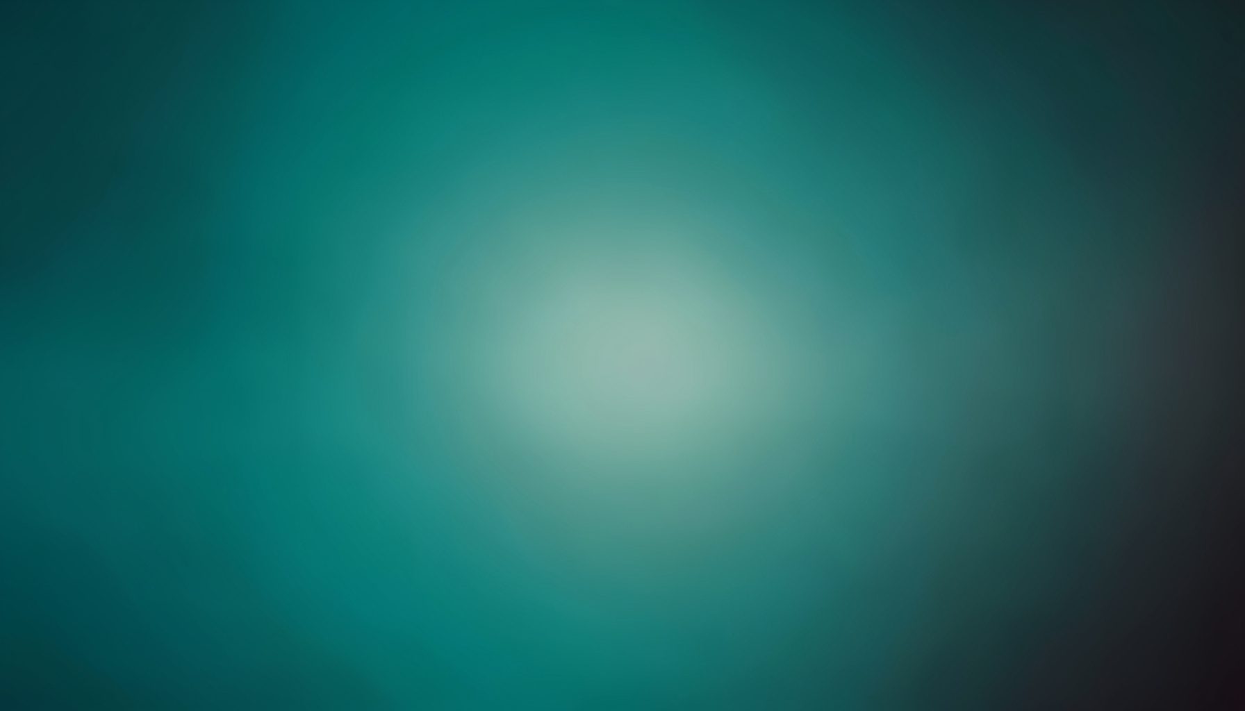 A warm, soft gradient of deep teal fading into muted charcoal, with a gentle central glow suggesting quiet contemplation and morning light